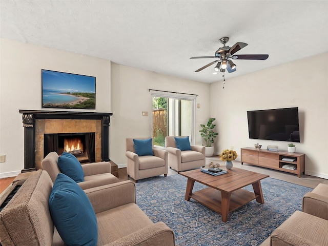 12605 Burninglog Ln, Dallas, TX 75243 - living area with a ceiling fan, a fireplace, baseboards, and wood finished floors