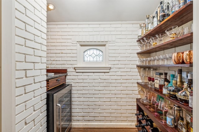4549 Walnut Hill Ln, Dallas, TX 75229 - bar featuring wine cooler and brick wall