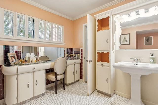 4549 Walnut Hill Ln, Dallas, TX 75229 - bathroom featuring crown molding, a sink, and baseboards