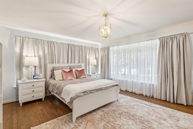 4549 Walnut Hill Ln, Dallas, TX 75229 - bedroom featuring ornamental molding, a chandelier, and wood finished floors