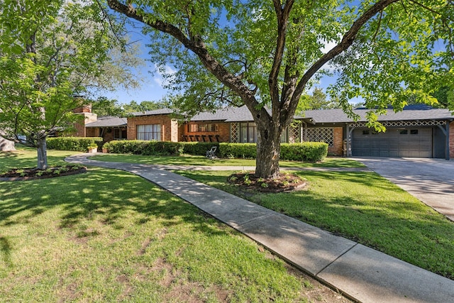4549 Walnut Hill Ln, Dallas, TX 75229 - single story home with brick siding, a garage, driveway, and a front yard