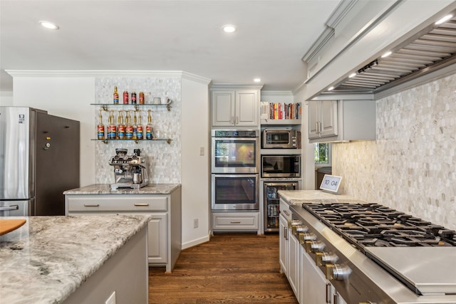 4549 Walnut Hill Ln, Dallas, TX 75229 - kitchen with premium range hood, appliances with stainless steel finishes, tasteful backsplash, dark wood finished floors, and light stone countertops