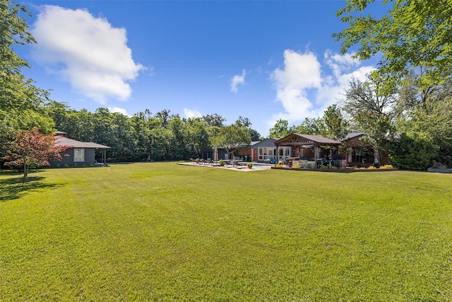 4549 Walnut Hill Ln, Dallas, TX 75229 - view of green lawn with a patio area, a gazebo, and a swimming pool