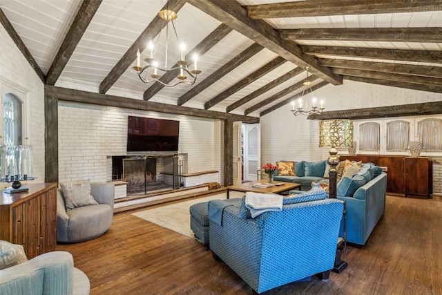4549 Walnut Hill Ln, Dallas, TX 75229 - living room featuring a chandelier, wood finished floors, brick wall, and a fireplace