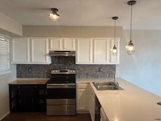 151 Henry M Chandler Dr Unit P, Rockwall, TX 75032 - kitchen with electric stove, under cabinet range hood, a sink, tasteful backsplash, and light countertops