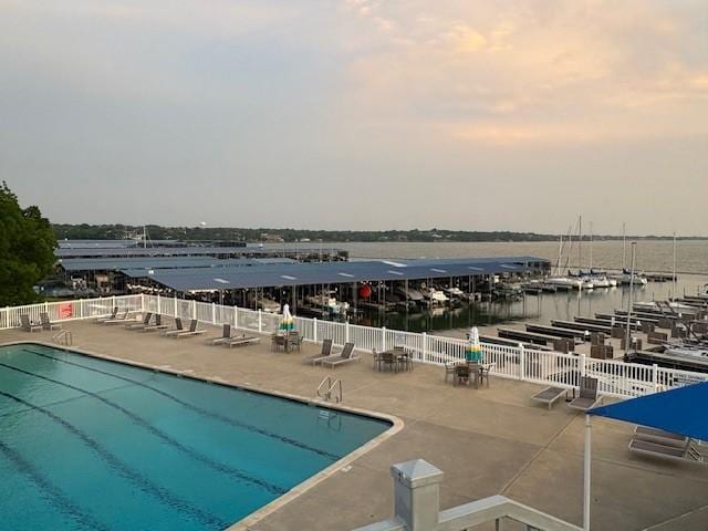 151 Henry M Chandler Dr Unit P, Rockwall, TX 75032 - community pool with a water view, a patio, and fence