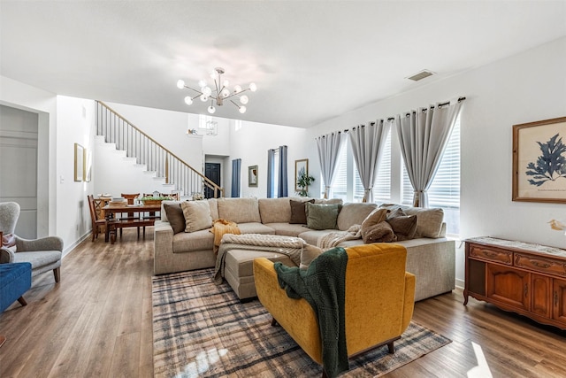 3942 Oak Crk, Denison, TX 75020 - living room featuring a chandelier, wood finished floors, stairway, and baseboards
