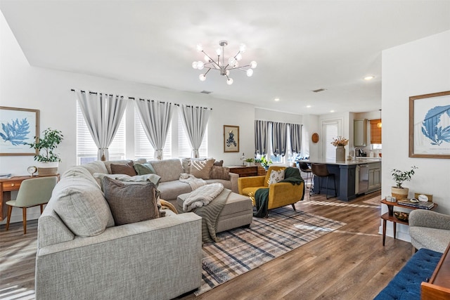 3942 Oak Crk, Denison, TX 75020 - living room featuring wood finished floors, a chandelier, and recessed lighting