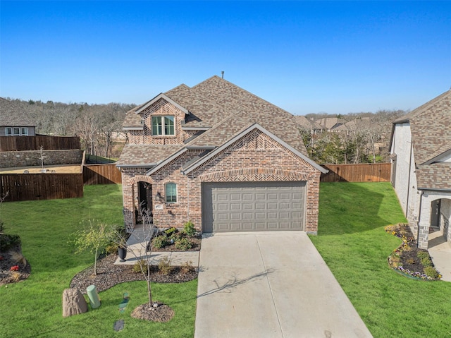 3942 Oak Crk, Denison, TX 75020 - view of front of home featuring roof with shingles, brick siding, and driveway