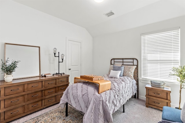 3942 Oak Crk, Denison, TX 75020 - bedroom featuring vaulted ceiling, light carpet, and baseboards