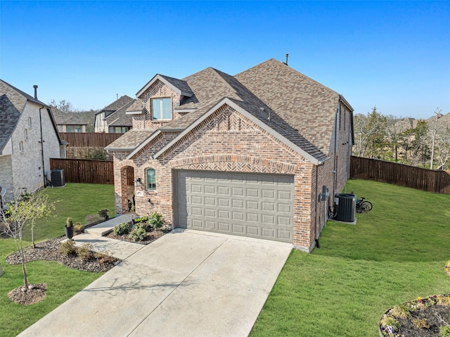 3942 Oak Crk, Denison, TX 75020 - view of front facade featuring brick siding, a shingled roof, an attached garage, cooling unit, and concrete driveway