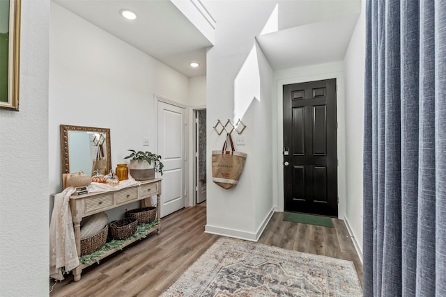 3942 Oak Crk, Denison, TX 75020 - entrance foyer featuring wood finished floors, recessed lighting, and baseboards