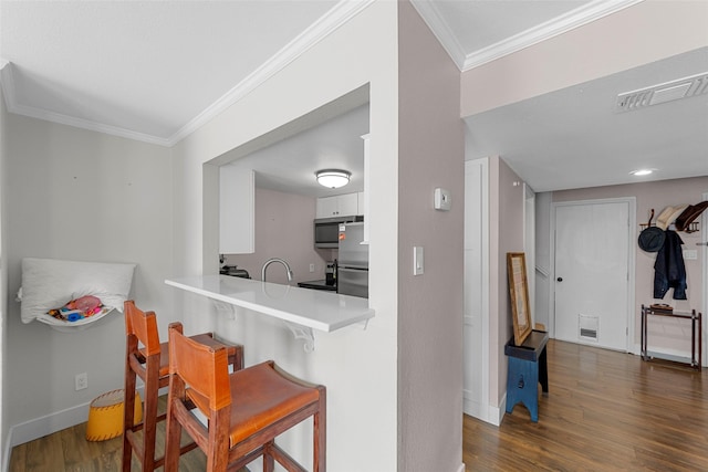 8400 Hickory St Unit 103, Frisco, TX 75034 - hallway featuring crown molding, dark wood-type flooring, and baseboards