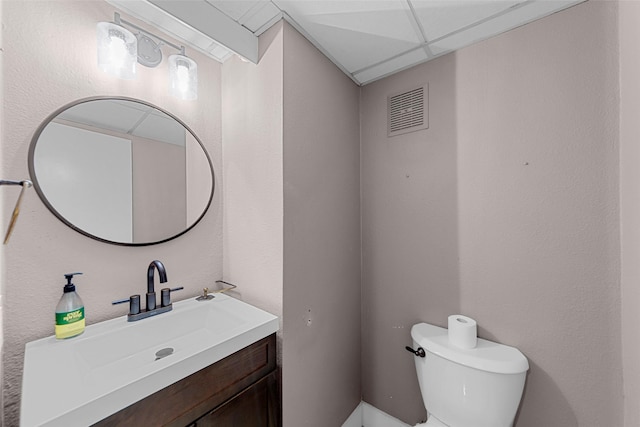 8400 Hickory St Unit 103, Frisco, TX 75034 - half bathroom featuring toilet and vanity