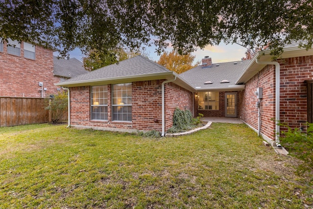 1275 Shores Blvd, Rockwall, TX 75087 - back of house with brick siding, a chimney, and roof with shingles