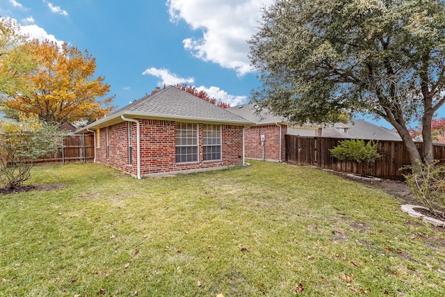 1275 Shores Blvd, Rockwall, TX 75087 - rear view of property featuring brick siding, a shingled roof, and a chimney