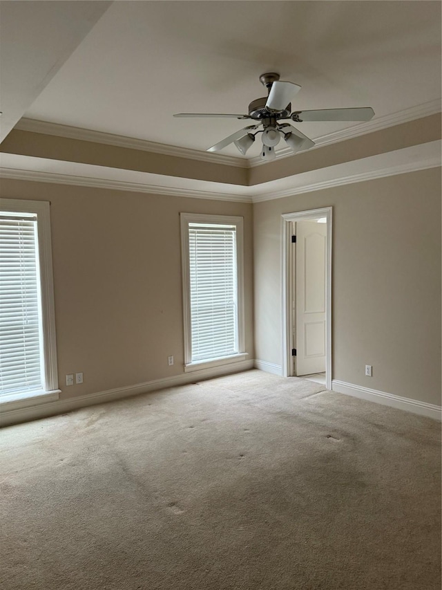 5714 Ferrell Dr, Shreveport, LA 71129 - unfurnished room with a raised ceiling, ornamental molding, carpet flooring, a ceiling fan, and baseboards
