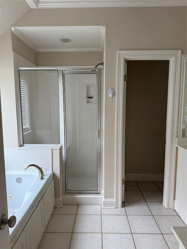 5714 Ferrell Dr, Shreveport, LA 71129 - bathroom with tile patterned flooring, a shower stall, a whirlpool tub, crown molding, and baseboards