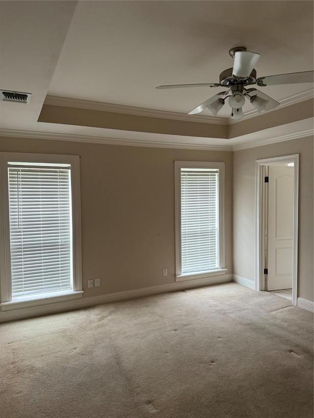 5714 Ferrell Dr, Shreveport, LA 71129 - unfurnished room featuring a tray ceiling, carpet floors, ornamental molding, a ceiling fan, and baseboards