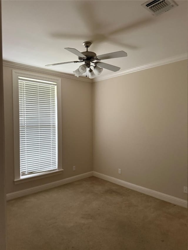 5714 Ferrell Dr, Shreveport, LA 71129 - carpeted empty room featuring ceiling fan, baseboards, ornamental molding, and healthy amount of natural light