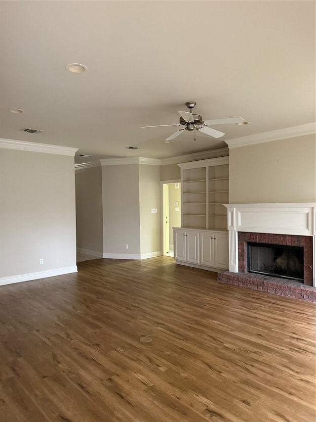 5714 Ferrell Dr, Shreveport, LA 71129 - unfurnished living room featuring baseboards, ornamental molding, wood finished floors, a fireplace, and a ceiling fan