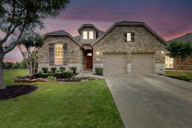 3716 Alder Dr, Mckinney, TX 75071 - view of front of house with stone siding, driveway, brick siding, and an attached garage