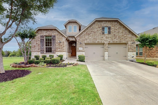 3716 Alder Dr, Mckinney, TX 75071 - view of front of home with driveway, stone siding, and brick siding