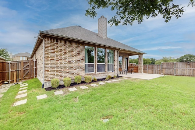 3716 Alder Dr, Mckinney, TX 75071 - back of property with a patio area, brick siding, and a chimney