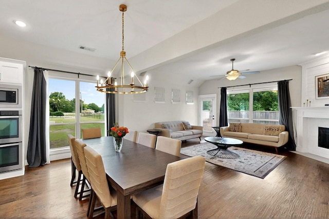 3716 Alder Dr, Mckinney, TX 75071 - dining space featuring a fireplace with flush hearth, a chandelier, dark wood finished floors, recessed lighting, and ceiling fan
