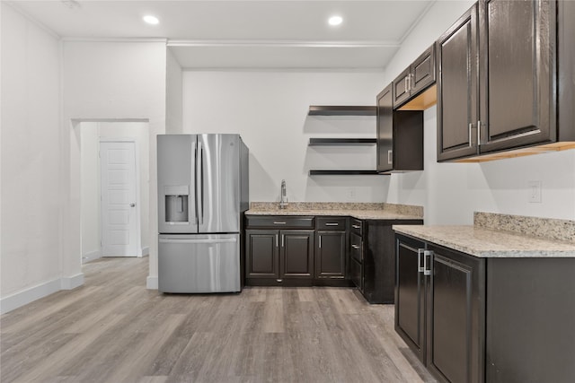 1601 N 11th St, Waco, TX 76707 - kitchen with stainless steel fridge with ice dispenser, light wood-style floors, open shelves, dark brown cabinets, and recessed lighting