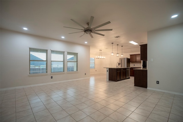 1543 Meadowlake Dr, Waxahachie, TX 75165 - unfurnished living room with a ceiling fan, light tile patterned floors, recessed lighting, baseboards, and a chandelier