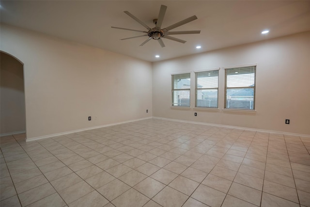 1543 Meadowlake Dr, Waxahachie, TX 75165 - spare room featuring a ceiling fan, recessed lighting, arched walkways, baseboards, and light tile patterned floors