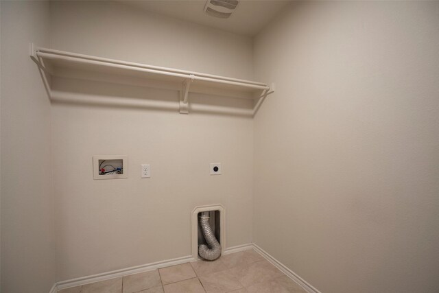 1543 Meadowlake Dr, Waxahachie, TX 75165 - laundry room featuring electric dryer hookup, washer hookup, baseboards, and light tile patterned floors