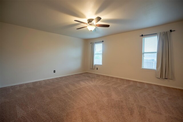 1543 Meadowlake Dr, Waxahachie, TX 75165 - empty room with a ceiling fan, carpet floors, and baseboards