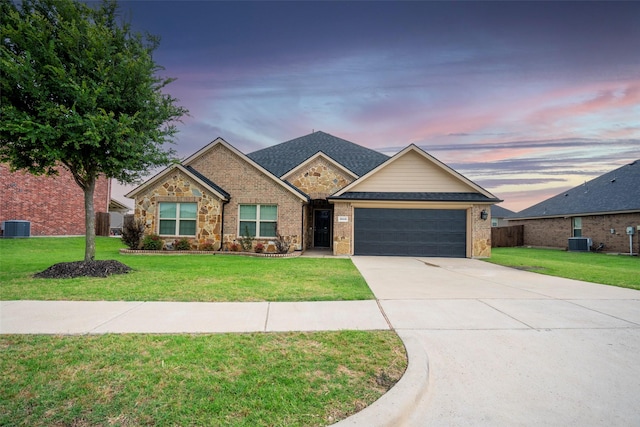 1543 Meadowlake Dr, Waxahachie, TX 75165 - view of front of house featuring central air condition unit, a garage, concrete driveway, and brick siding