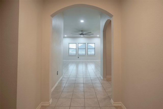 1543 Meadowlake Dr, Waxahachie, TX 75165 - hallway featuring arched walkways, light tile patterned floors, baseboards, and recessed lighting