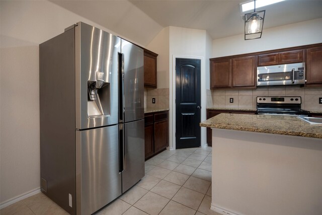 1543 Meadowlake Dr, Waxahachie, TX 75165 - kitchen with stainless steel appliances, tasteful backsplash, light stone countertops, light tile patterned flooring, and dark brown cabinets