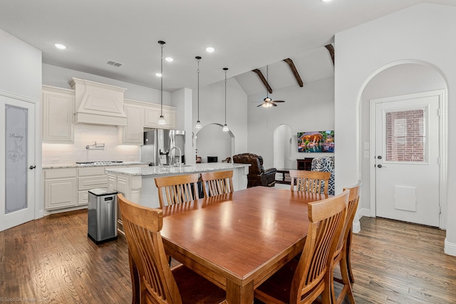 2139 Devonblue Dr, Forney, TX 75126 - dining space with ceiling fan, dark wood-type flooring, recessed lighting, arched walkways, and vaulted ceiling