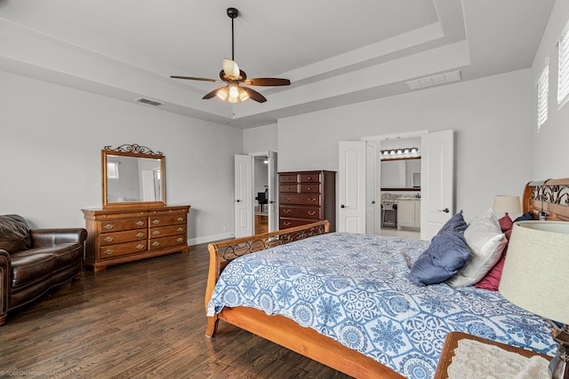 2139 Devonblue Dr, Forney, TX 75126 - bedroom with a raised ceiling, wood finished floors, a ceiling fan, and baseboards