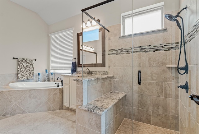 2139 Devonblue Dr, Forney, TX 75126 - bathroom featuring a shower stall, a garden tub, vaulted ceiling, and tile patterned flooring