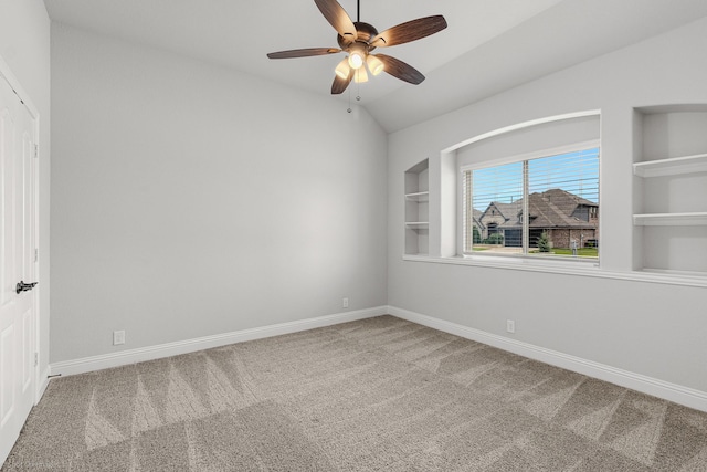 2139 Devonblue Dr, Forney, TX 75126 - carpeted spare room featuring a ceiling fan, built in shelves, baseboards, and lofted ceiling