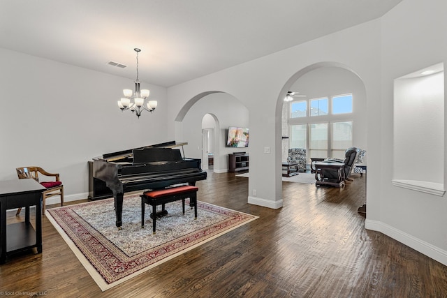 2139 Devonblue Dr, Forney, TX 75126 - sitting room with arched walkways, dark wood finished floors, and baseboards