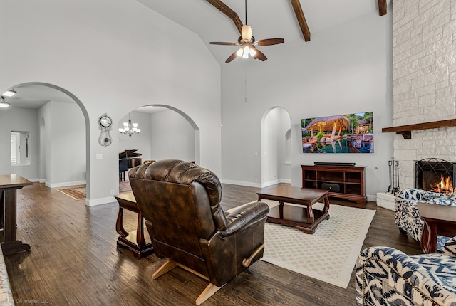2139 Devonblue Dr, Forney, TX 75126 - living room with arched walkways, ceiling fan, high vaulted ceiling, a fireplace, and dark wood finished floors
