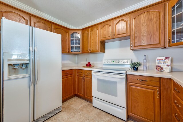 1096 Cedar Oak Dr, Pottsboro, TX 75076 - kitchen featuring white appliances, brown cabinets, glass insert cabinets, and light countertops