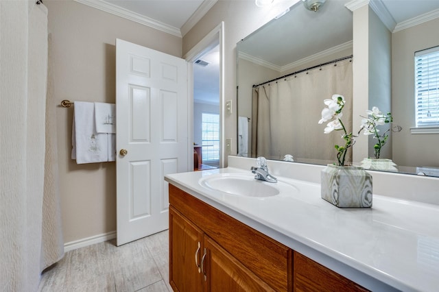 1096 Cedar Oak Dr, Pottsboro, TX 75076 - bathroom featuring vanity, crown molding, healthy amount of natural light, baseboards, and wood finished floors