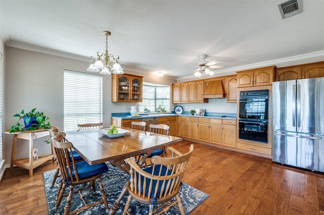 1096 Cedar Oak Dr, Pottsboro, TX 75076 - kitchen with black appliances, premium range hood, ornamental molding, glass insert cabinets, and light countertops