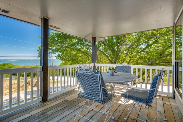 1096 Cedar Oak Dr, Pottsboro, TX 75076 - wooden deck with outdoor dining space and a water view