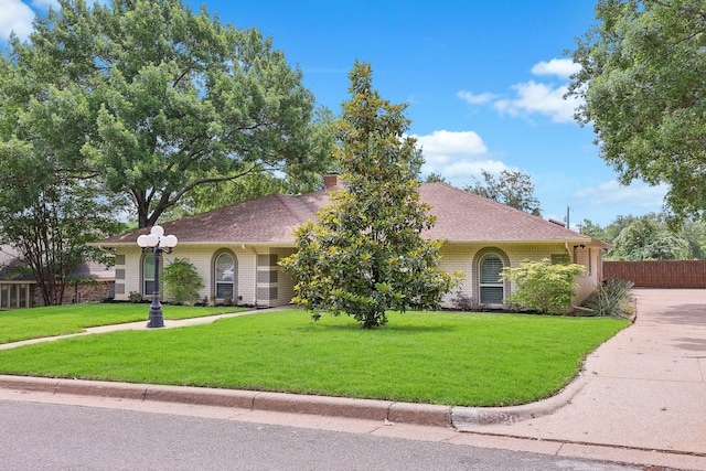 8820 Hunters Glen Trl, Fort Worth, TX 76120 - view of front facade with a chimney and brick siding