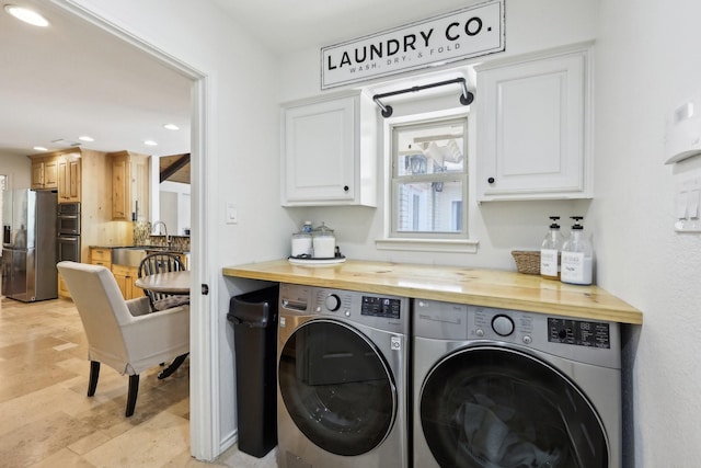 8820 Hunters Glen Trl, Fort Worth, TX 76120 - laundry room with washing machine and dryer, cabinet space, and recessed lighting