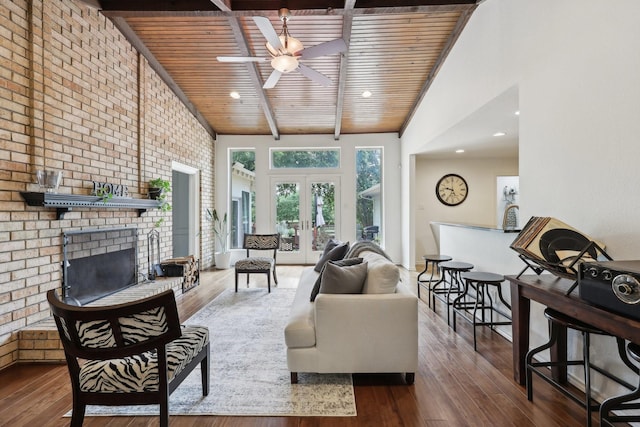 8820 Hunters Glen Trl, Fort Worth, TX 76120 - living area with ceiling fan, wood ceiling with exposed beams, french doors, hardwood / wood-style floors, and a brick fireplace